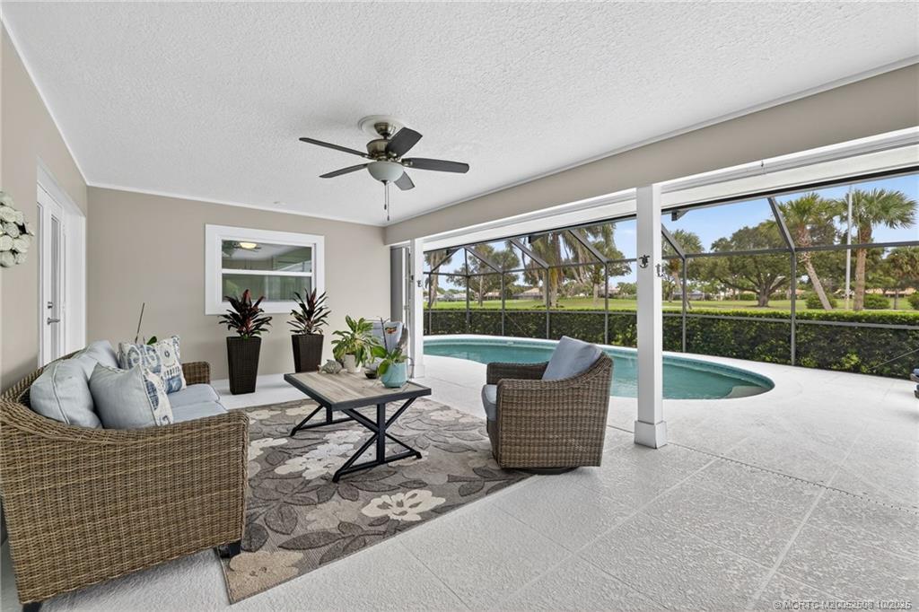 3353 Southeast Fairway East Stuart, FL 34997 - Photo 27 of 55 a living room with couch and a large window