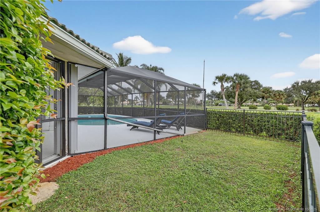 3353 Southeast Fairway East Stuart, FL 34997 - Photo 38 of 55 a view of a chair and table in the garden