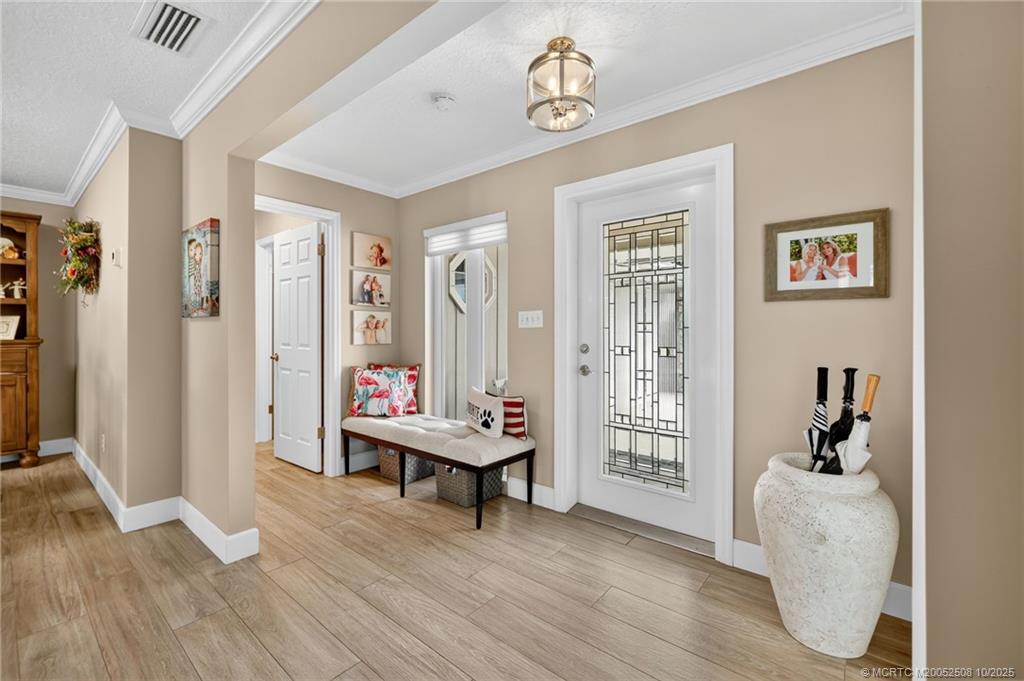 3353 Southeast Fairway East Stuart, FL 34997 - Photo 4 of 55 a living room with furniture and wooden floor