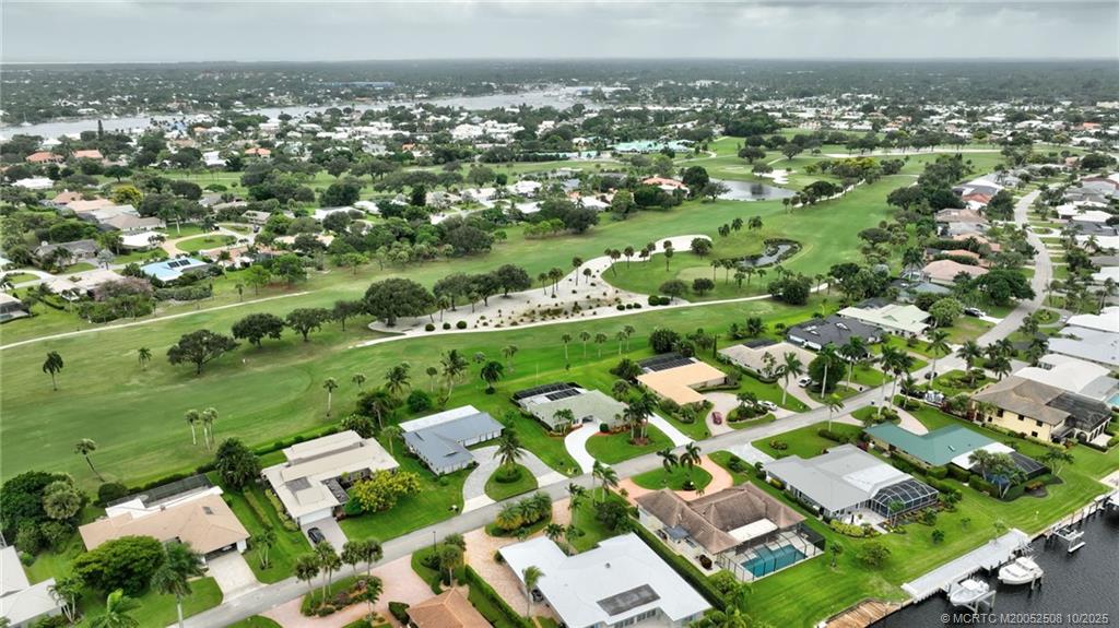 3353 Southeast Fairway East Stuart, FL 34997 - Photo 54 of 55 an aerial view of residential houses with outdoor space