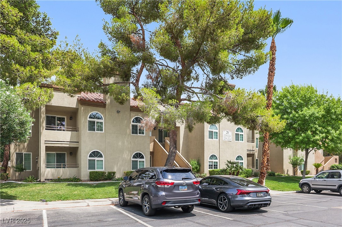 3145 East Flamingo Road, Unit 1123 Las Vegas, NV 89121 - Photo 2 of 30 View of building exterior with uncovered parking