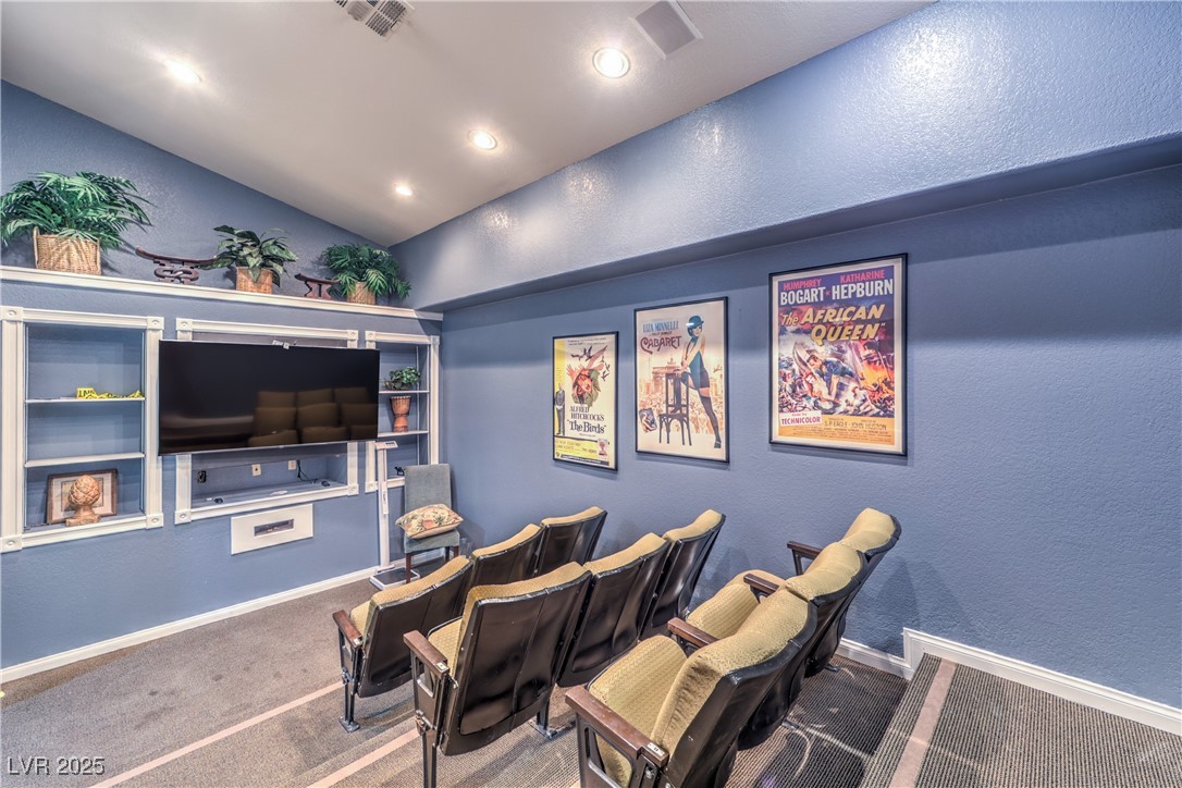 3145 East Flamingo Road, Unit 1123 Las Vegas, NV 89121 - Photo 25 of 30 Cinema with a textured wall, lofted ceiling, recessed lighting, and carpet floors