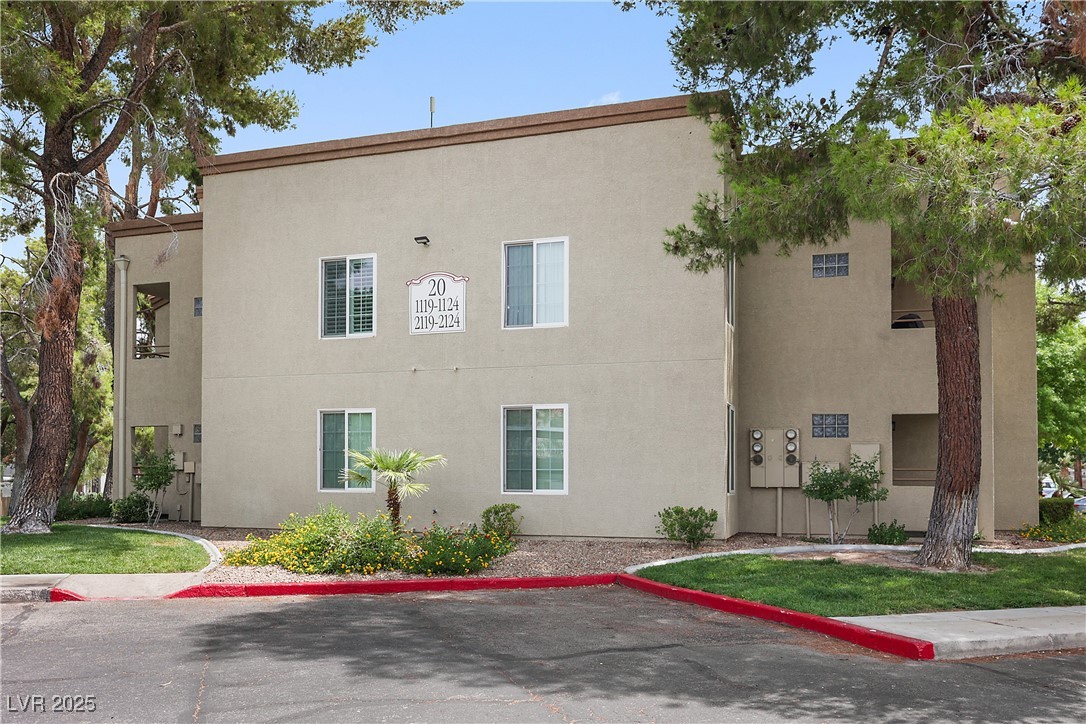 3145 East Flamingo Road, Unit 1123 Las Vegas, NV 89121 - Photo 29 of 30 View of side of home featuring stucco siding