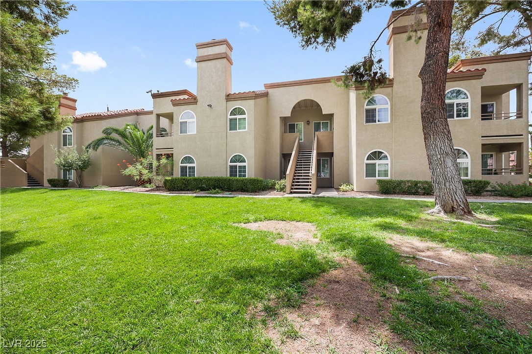 3145 East Flamingo Road, Unit 1123 Las Vegas, NV 89121 - Photo 3 of 30 View of building exterior featuring stairs