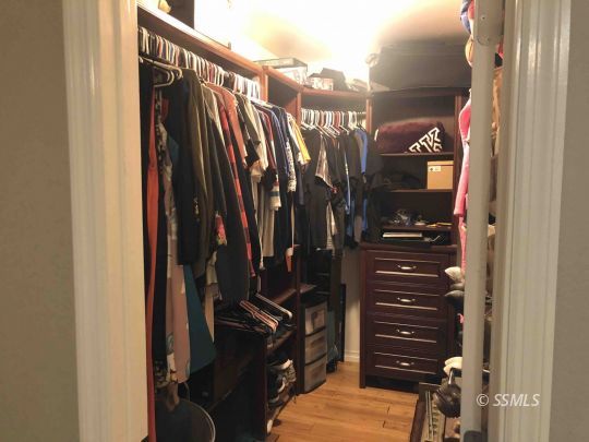 324 Mari Court Ridgecrest, CA 93555 - Photo 13 of 16 a view of walk in closet with clothes and shoes