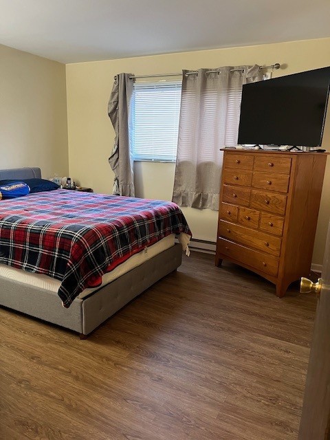14747 Kenton Avenue, Unit 2A Midlothian, IL 60445 - Photo 5 of 16 a spacious bedroom with a bed and a television