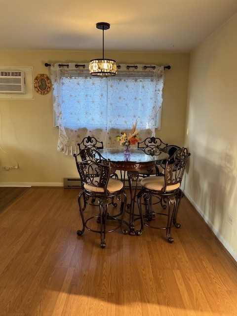 14747 Kenton Avenue, Unit 2A Midlothian, IL 60445 - Photo 6 of 16 a view of a dining room with furniture and wooden floor
