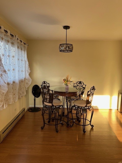 14747 Kenton Avenue, Unit 2A Midlothian, IL 60445 - Photo 7 of 16 a view of a dining room with furniture and wooden floor