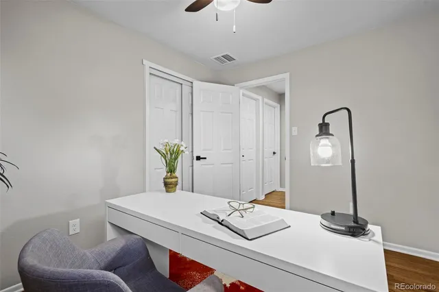 a bedroom with a bed and a table