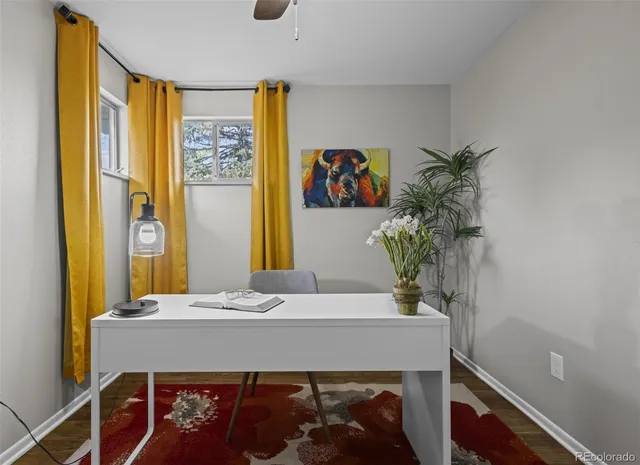 a room with a table and a potted plant