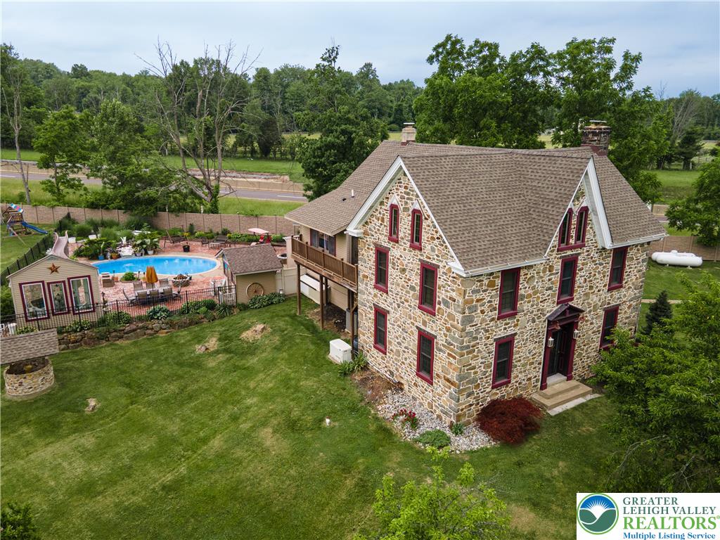 2485 Hieter Road Quakertown, PA 18951 - Photo 73 of 97 A stone-clad residence with an inviting outdoor pool area.