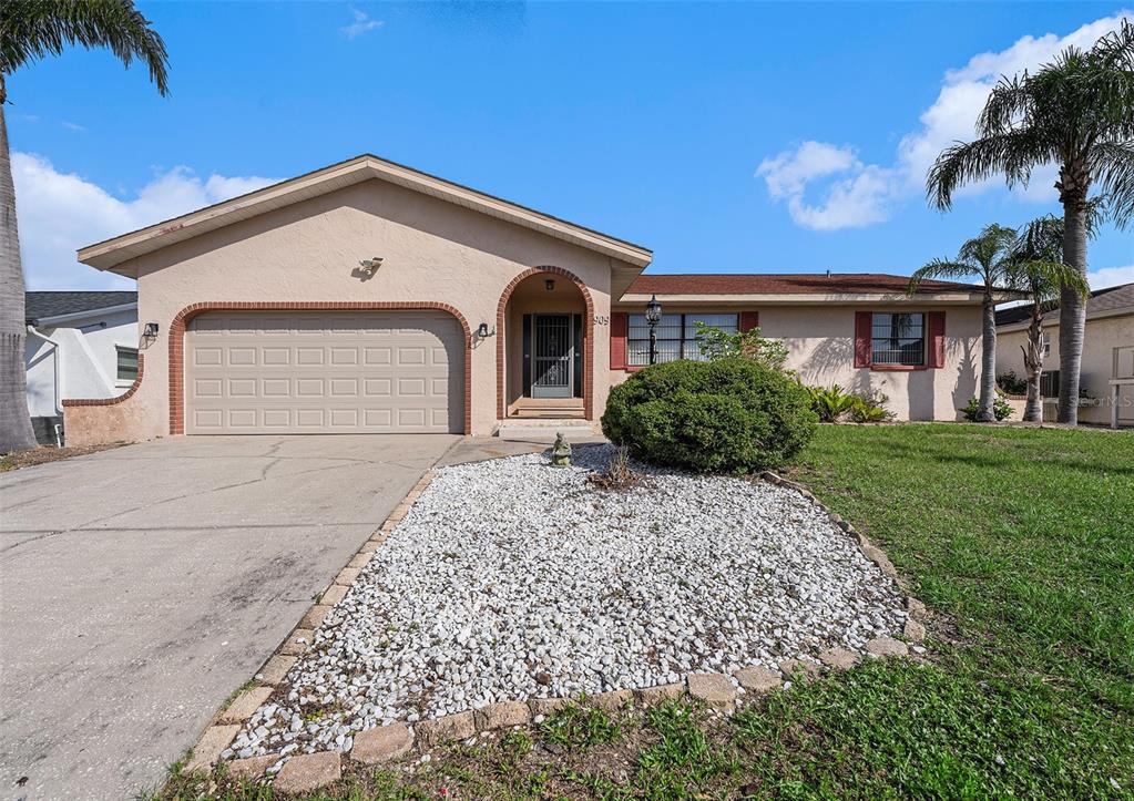 front view of a house with a yard