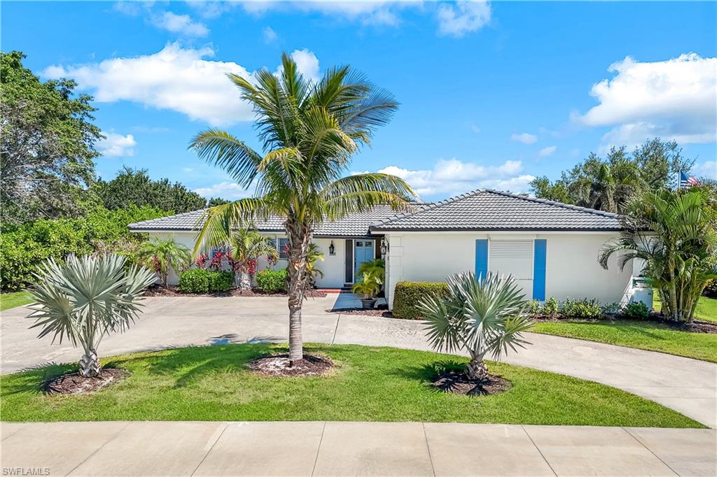 a front view of house with yard and green space