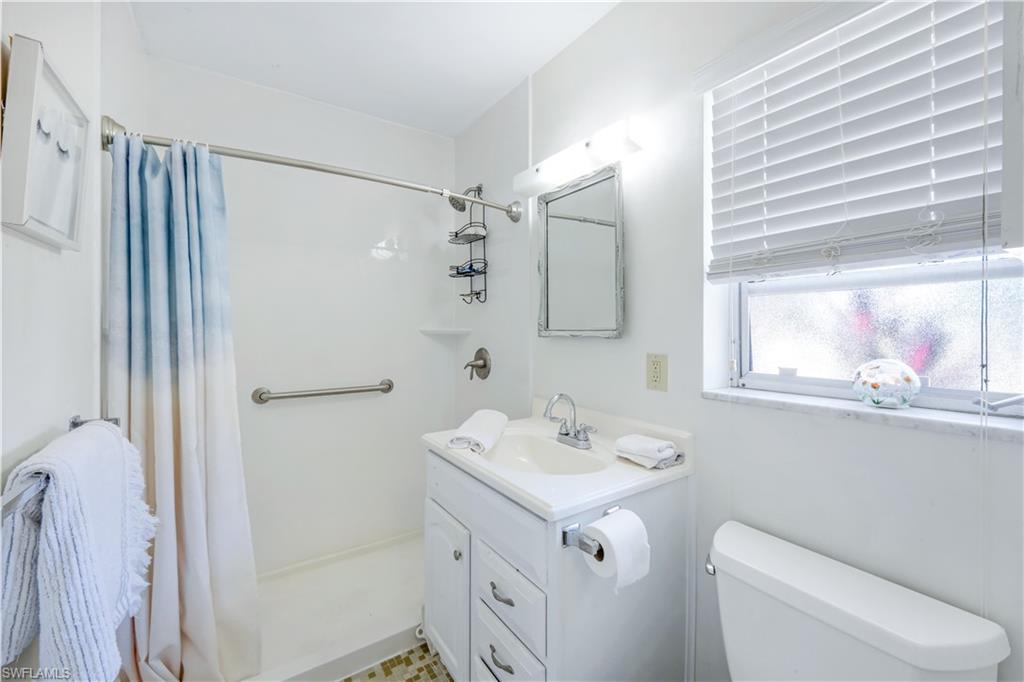 1382 Jamaica Road Marco Island, FL 34145 - Photo 13 of 27 a bathroom with a sink a toilet and shower