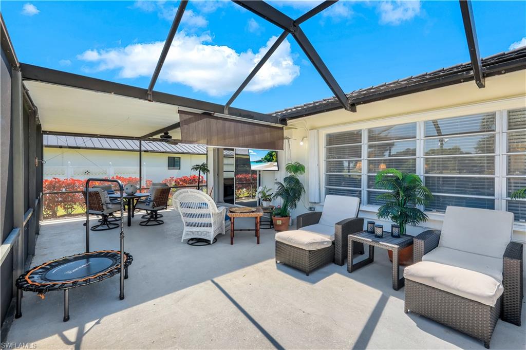 1382 Jamaica Road Marco Island, FL 34145 - Photo 19 of 27 a living room with patio furniture and a potted plant