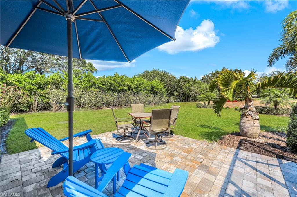 1382 Jamaica Road Marco Island, FL 34145 - Photo 20 of 27 a view of a chair and table on the garden