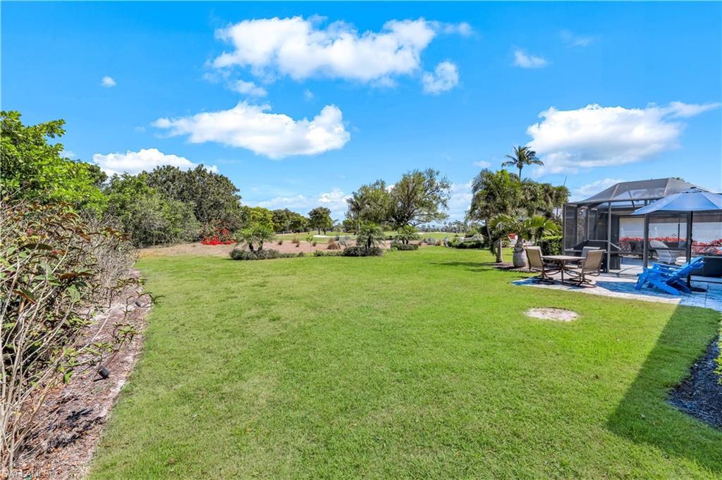 1382 Jamaica Road Marco Island, FL 34145 - Photo 22 of 27 a view of a golf course with a garden