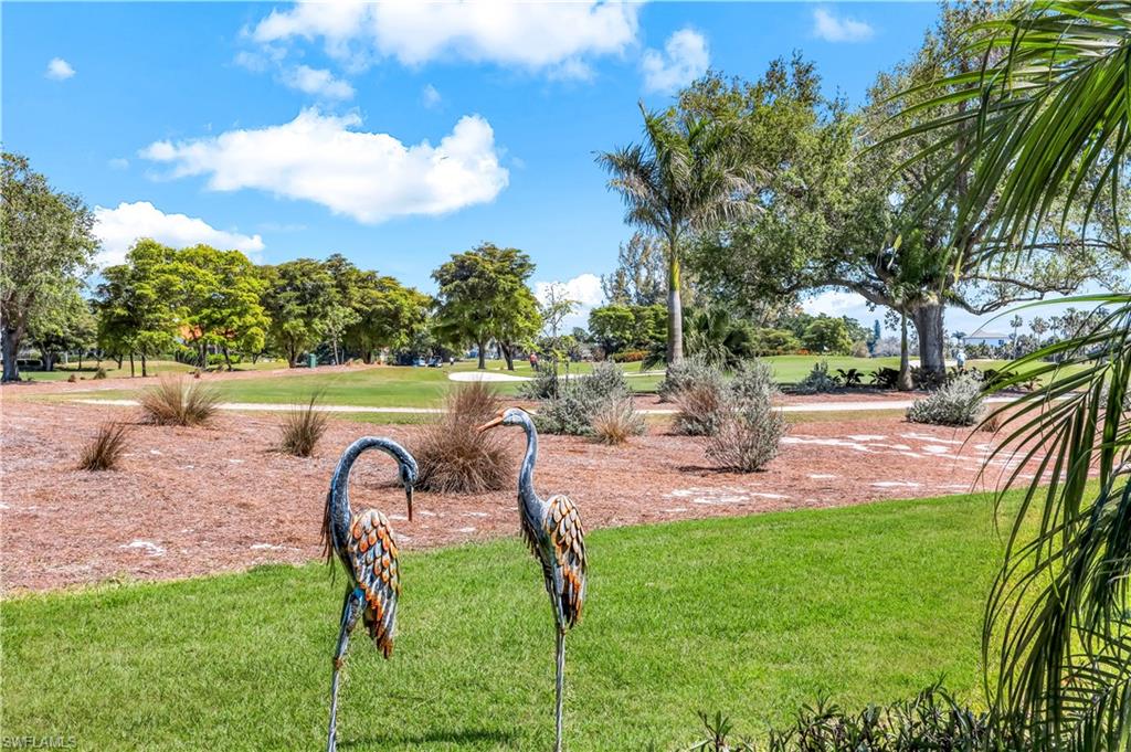 1382 Jamaica Road Marco Island, FL 34145 - Photo 26 of 27 a garden view with a seating space
