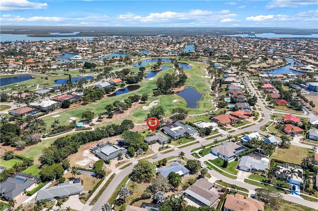 1382 Jamaica Road Marco Island, FL 34145 - Photo 27 of 27 an aerial view of residential building with parking