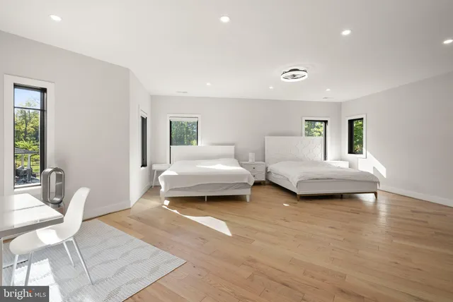 a bed room with furniture and a flat screen tv