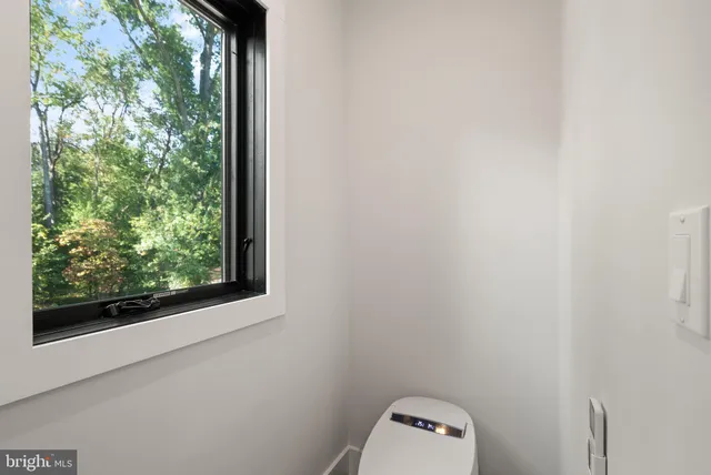 a bedroom with a bed and a table