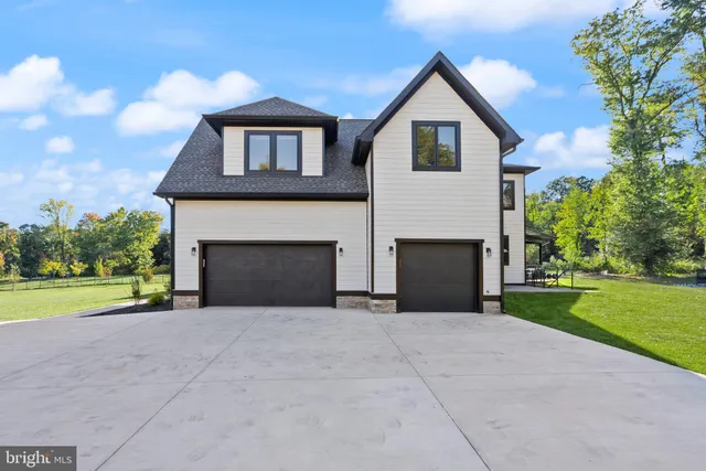 a view of wooden floor and windows in a room
