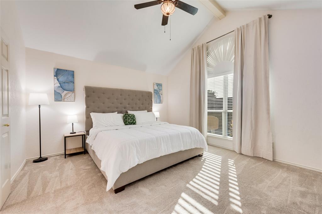 4027 Red Maple Drive Carrollton, TX 75007 - Photo 14 of 35 a bedroom with a bed lamp and window