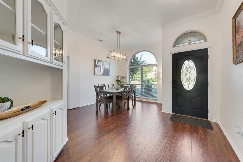 4027 Red Maple Drive Carrollton, TX 75007 - Photo 2 of 35 a view of a dining room with furniture window and wooden floor