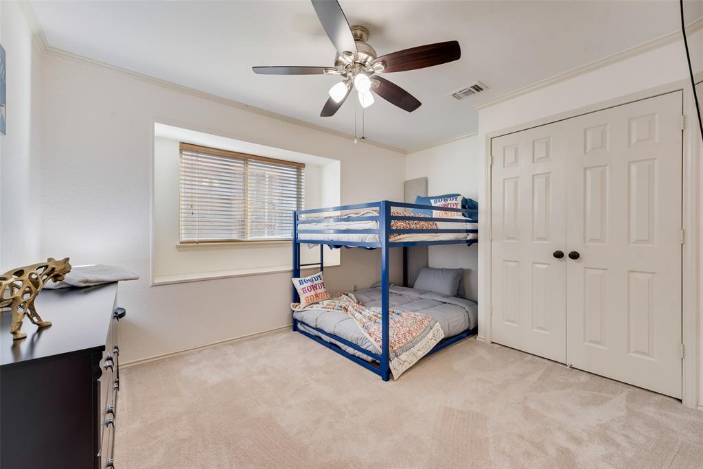 4027 Red Maple Drive Carrollton, TX 75007 - Photo 22 of 35 a bed room with a bed and a window