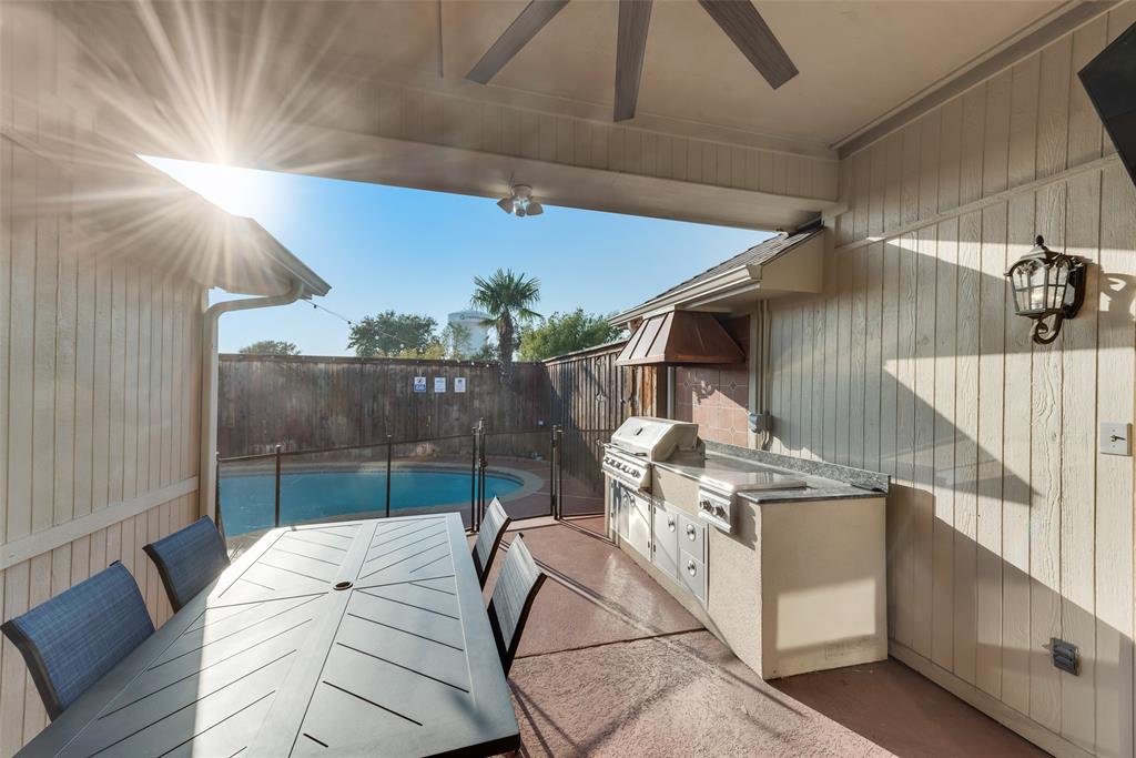 4027 Red Maple Drive Carrollton, TX 75007 - Photo 29 of 35 a view of a patio with table and chairs with wooden floor
