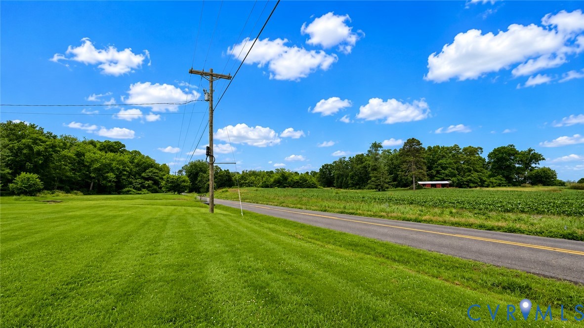 5560 West Hoover Road Reva, VA 22735 - Photo 14 of 32 Expansive green lawn bordering a paved road, surro