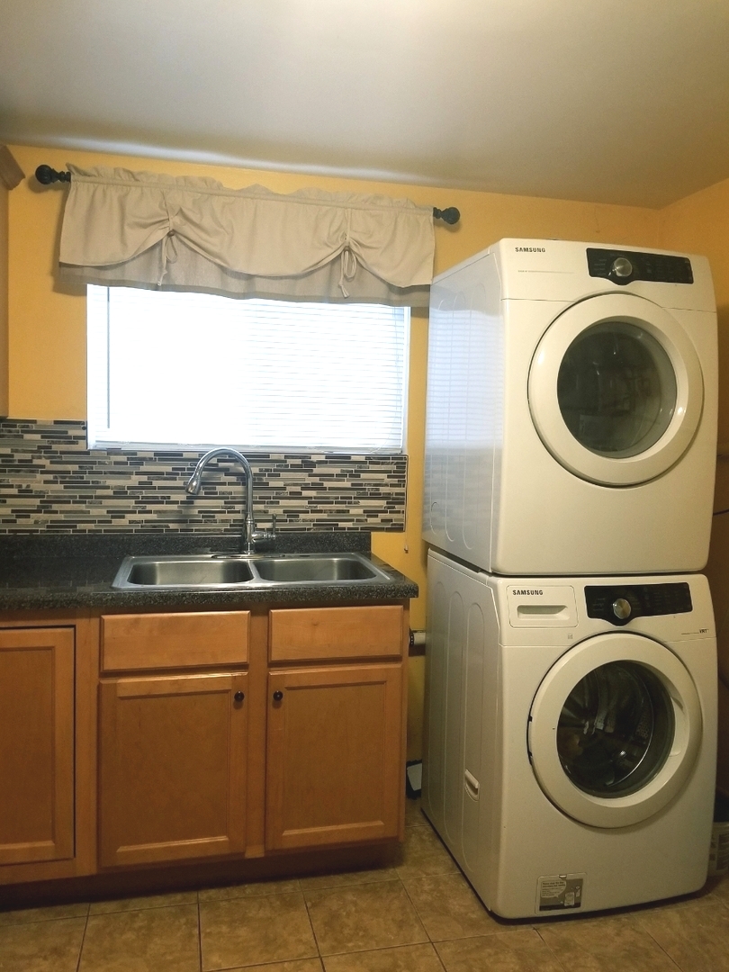 137 South Pinecrest Road Bolingbrook, IL 60440 - Photo 23 of 25 a view of a storage & utility room with washer and dryer