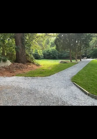 a view of a yard with an outdoor seating