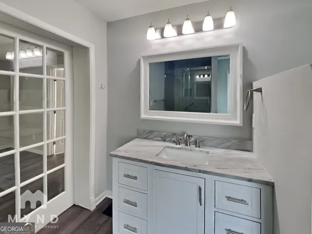 a bathroom with a sink and a mirror