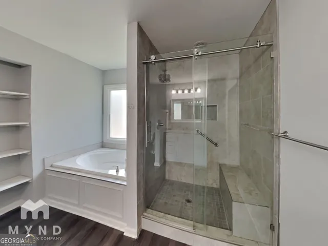 a bathroom with a glass shower door