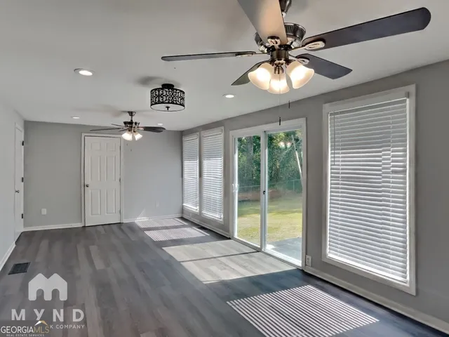 a view of an empty room with a window