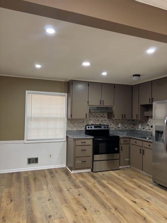 616 Fayetteville Road Jonesboro, GA 30236 - Photo 11 of 14 a kitchen with kitchen island granite countertop a stove and a sink
