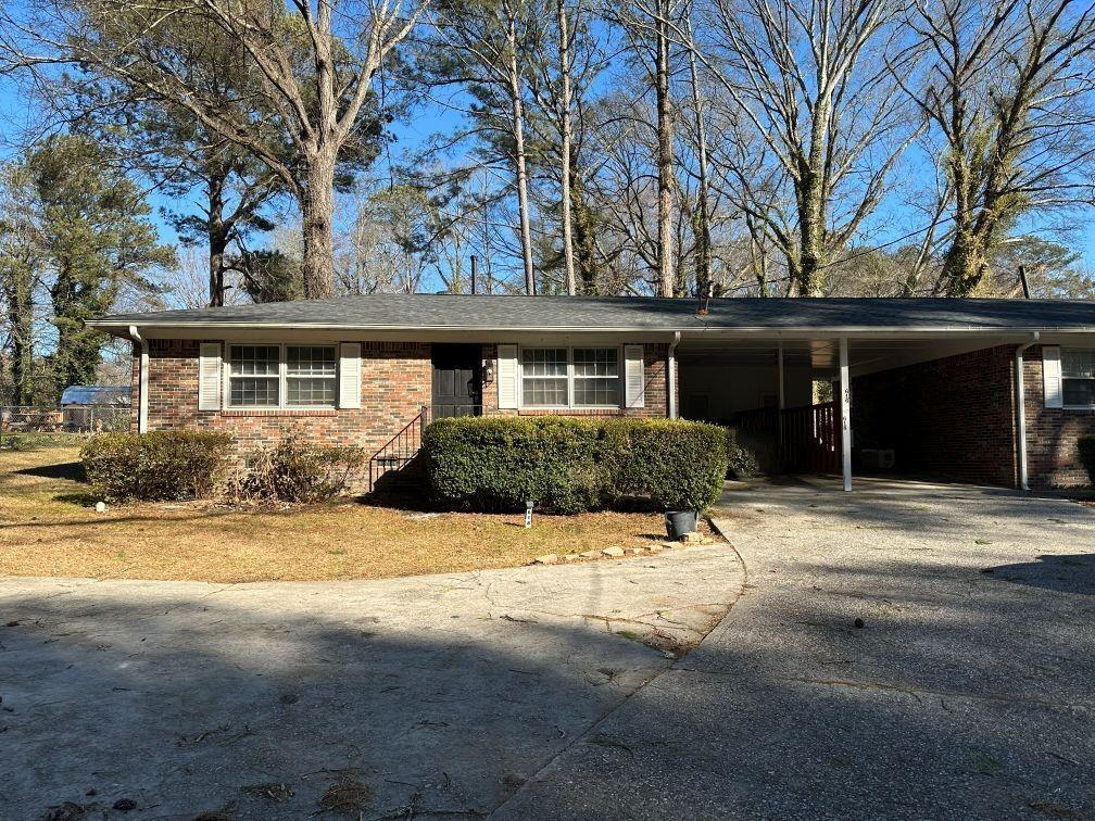 616 Fayetteville Road Jonesboro, GA 30236 - Photo 2 of 14 a house with yard in front of it
