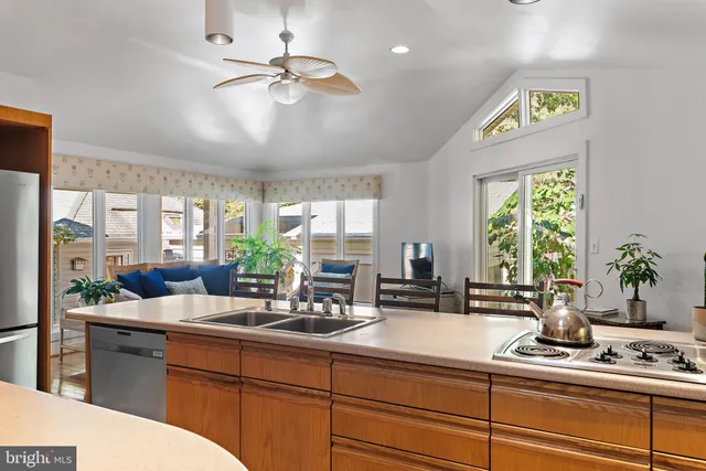 a kitchen with a sink and a counter top space