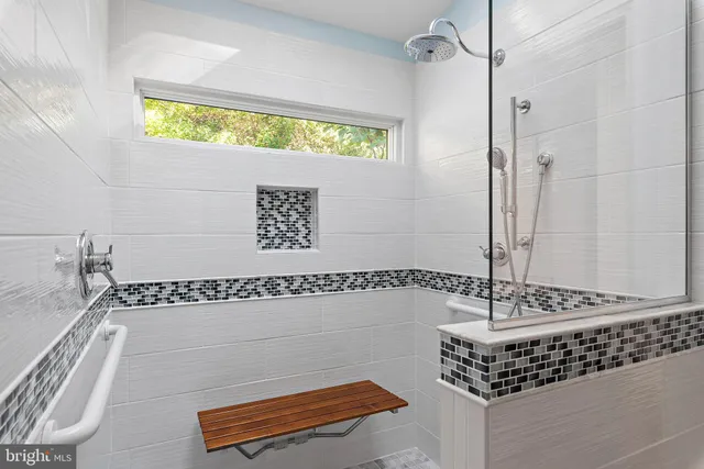 a bathroom with a bathtub and a shower