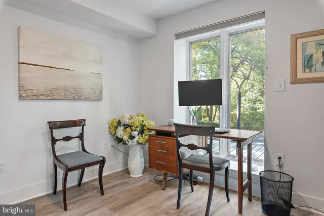 a dining room with furniture and window