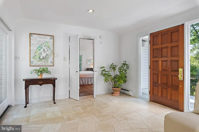 a view of room with furniture and windows