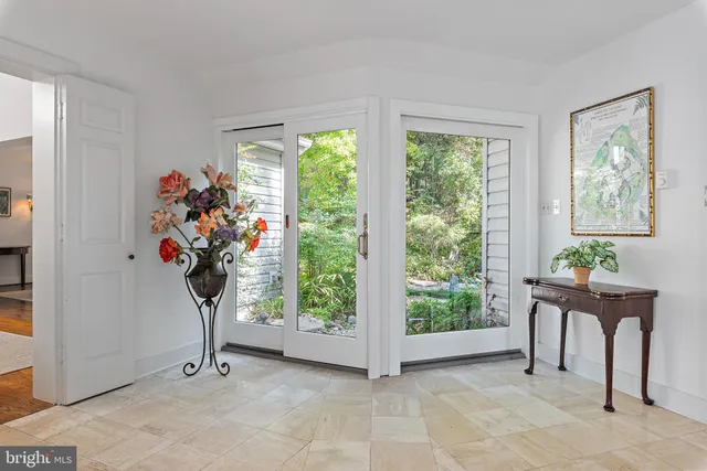 a view of room with furniture flower and a window
