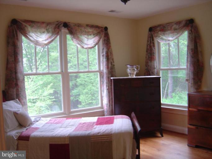 16820 Whites Store Road Boyds, MD 20841 - Photo 22 of 30 a bedroom with a bed and a window