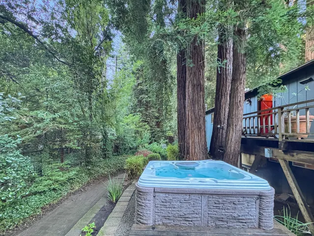 a view of a patio with table and chairs and potted plants