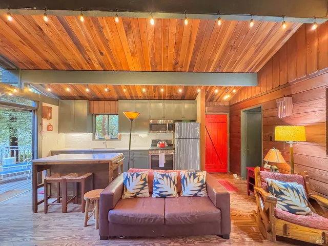 a bedroom with furniture and a large window