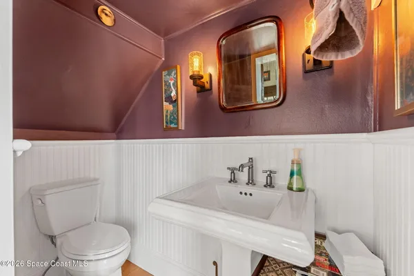 a living room with furniture and a chair