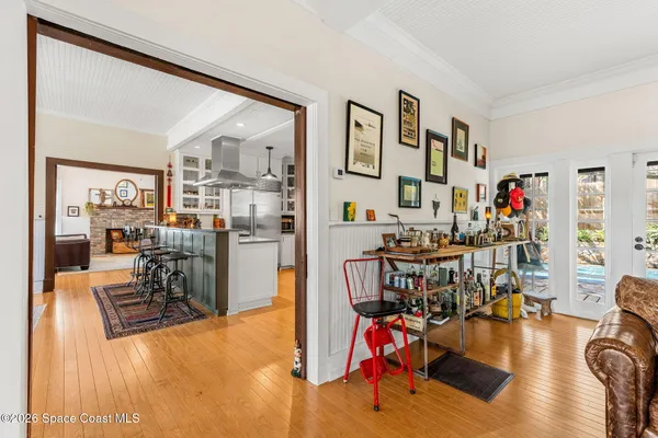 a front view of house with yard outdoor seating and large tree