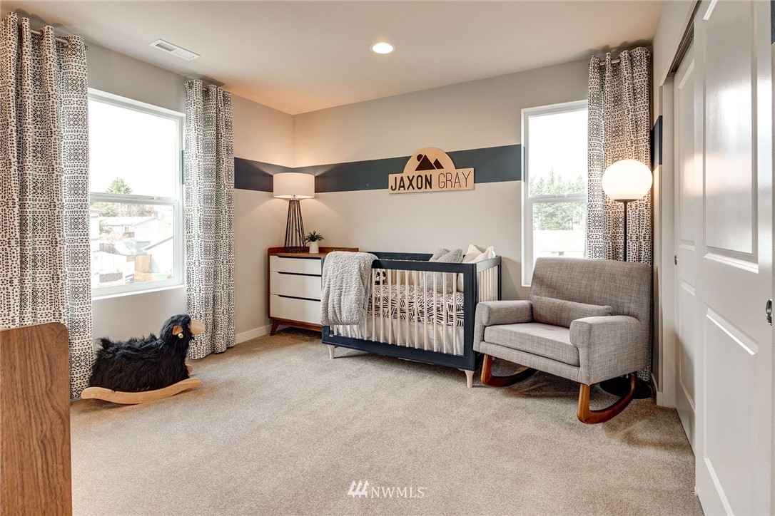 124 215th Street Southeast, Unit 7 Bothell, WA 98021 - Photo 22 of 25 a living room with furniture and a large window