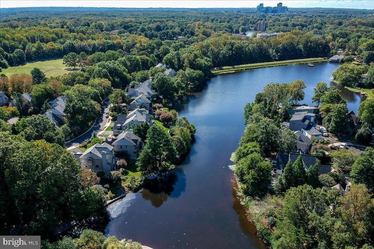 1460 Waterfront Road Reston, VA 20194 - Photo 1 of 59 an aerial view of a house with a yard and lake view